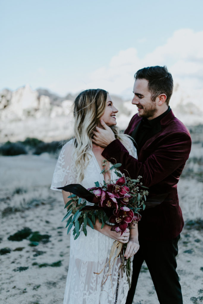 Jeremy holds Alyssa during their elopement in Joshua Tree National Park.