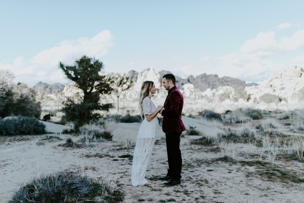 Alyssa and Jeremy stand together during their elopement ceremony in Joshua Tree National Park.