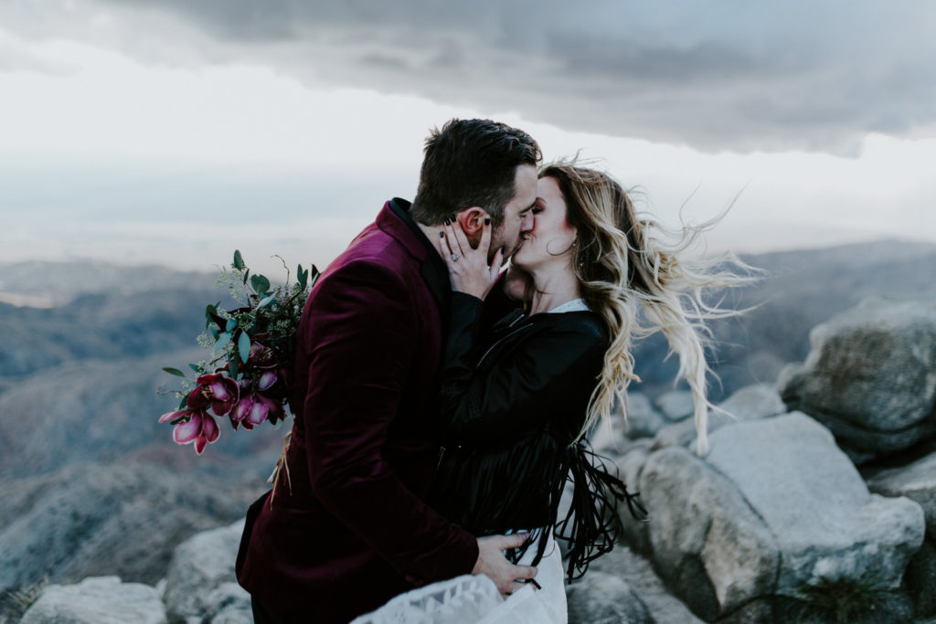 Alyssa and Jeremy kiss in Joshua Tree National Park.