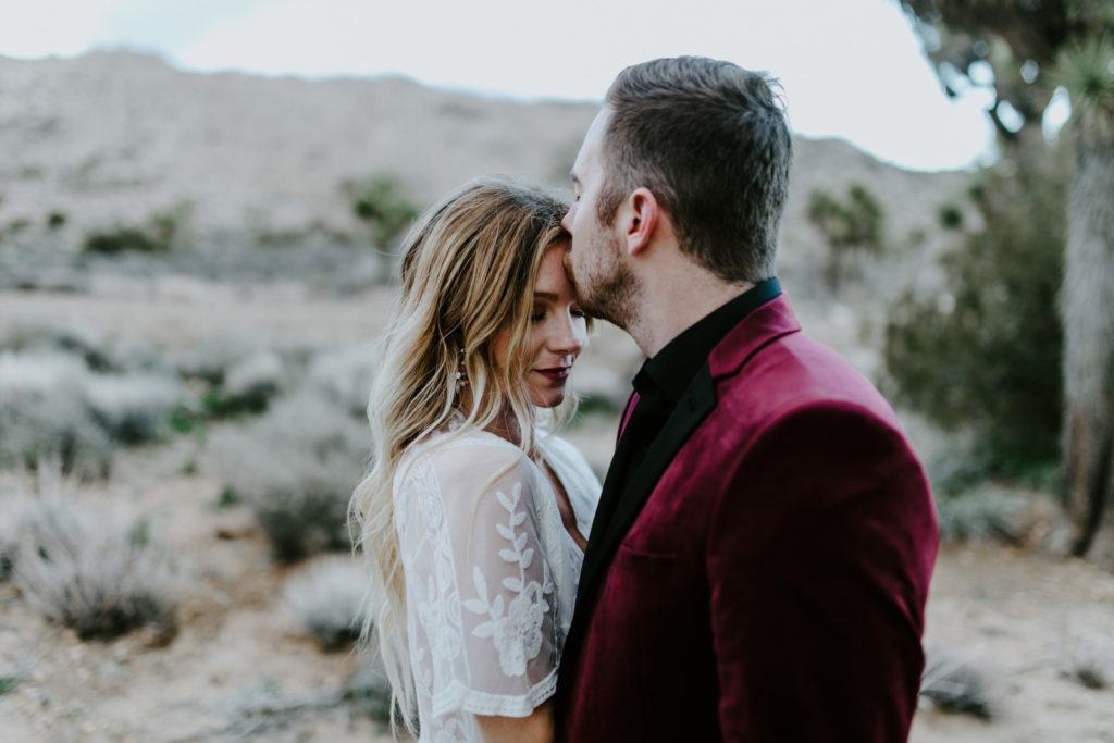 Jeremy kisses Alyssa after their elopement in Joshua Tree National Park.