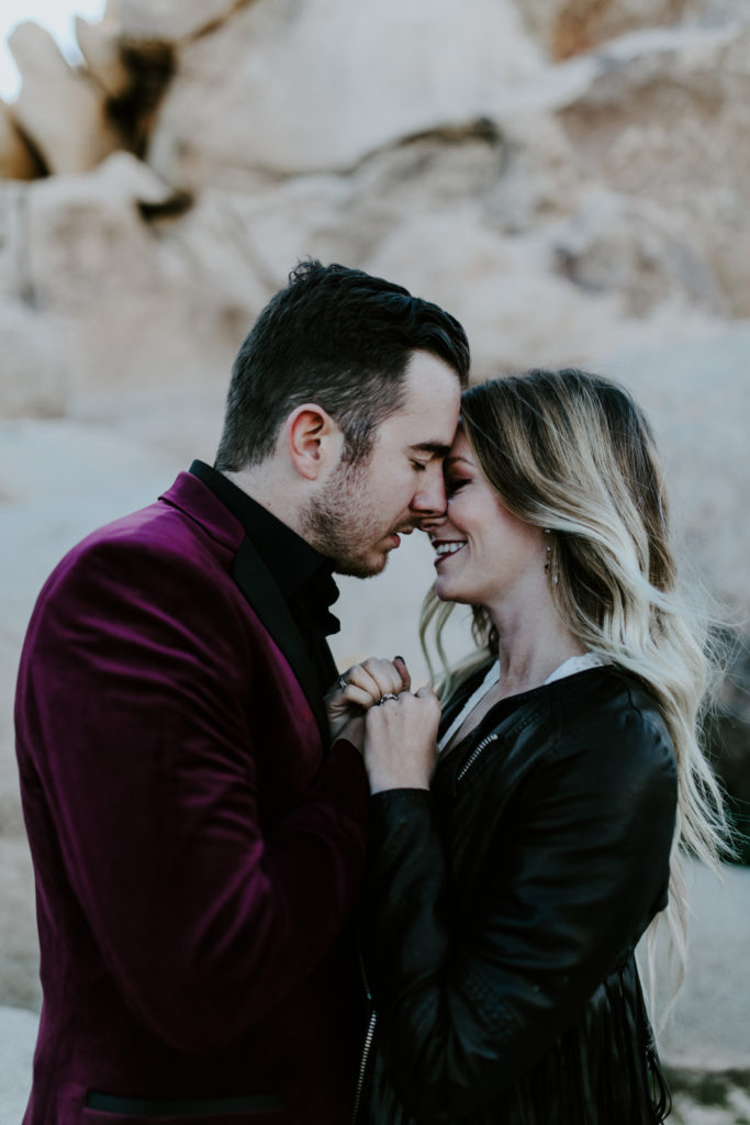 Alyssa and Jeremy go in for a kiss in Joshua Tree National Park.