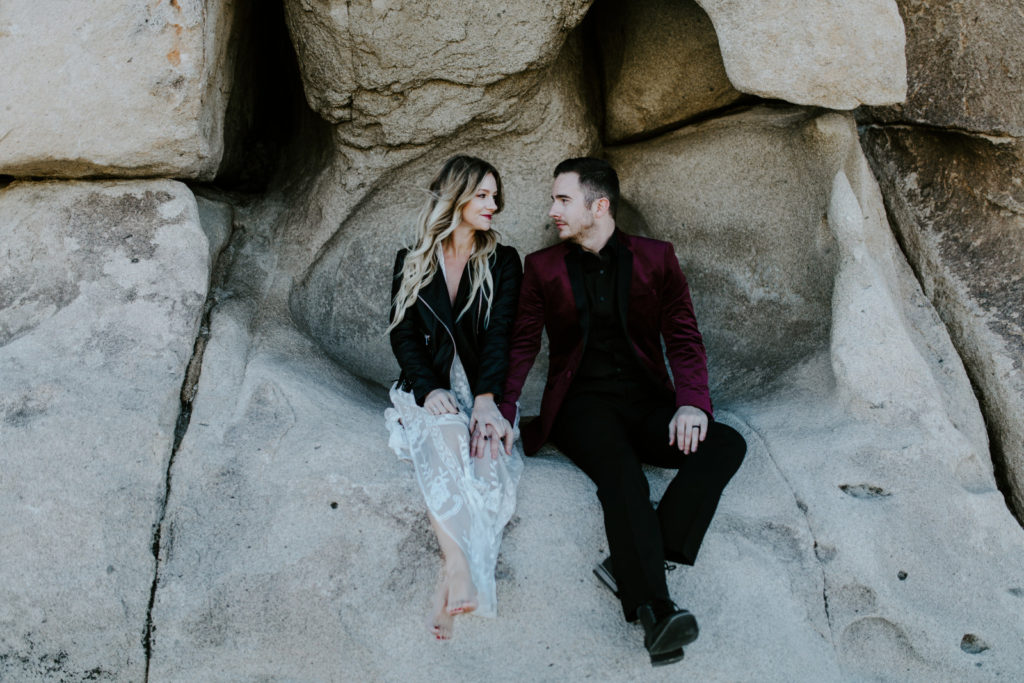 Jeremy and Alyssa sit on the rocks in Joshua Tree National Park.